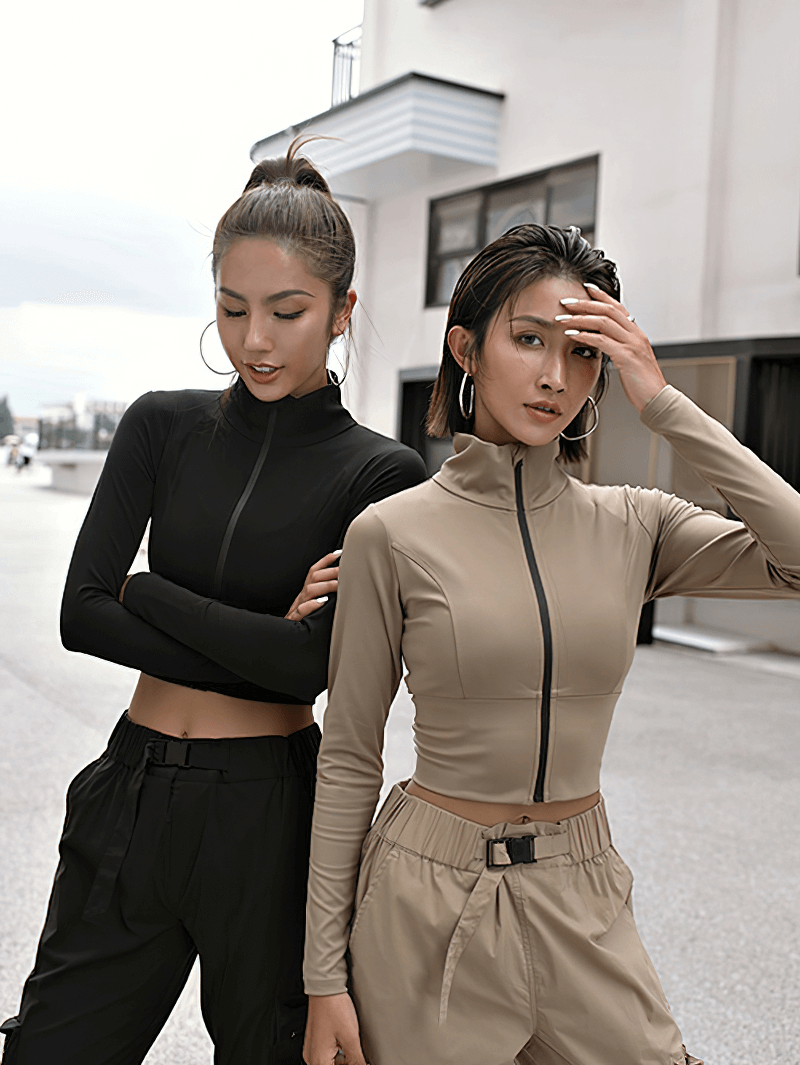 Two women wearing Sports Women's Zipper Elasticity Jacket in black and khaki, showcasing long sleeves and Mandarin collar design.